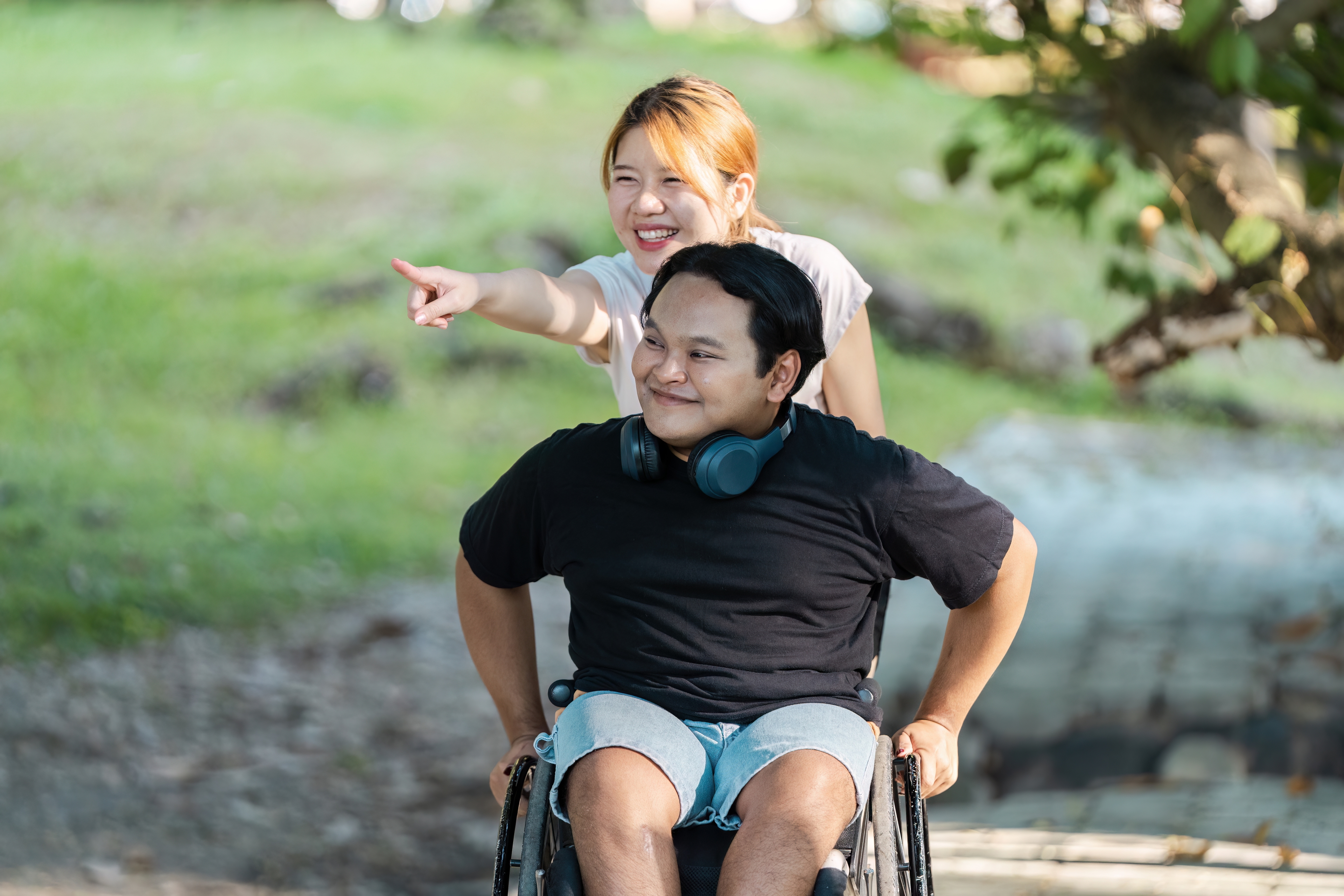 Caring support worker helping elderly person